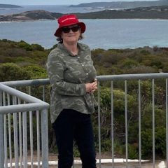MPA Patient Story - Carol Saunders standing at lookout with view of water behind