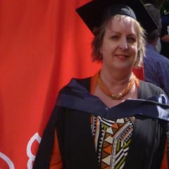 MPA Patient Story - Trish McDonald wearing graduation gown